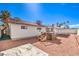 Back exterior view of a home featuring a hot tub and well-maintained backyard at 3163 High View Dr, Henderson, NV 89014