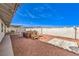 Wide backyard with gravel, a hot tub, and a concrete patio, great for entertaining at 3163 High View Dr, Henderson, NV 89014