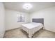 Well-lit bedroom with a simple design featuring a ceiling fan and a window at 3163 High View Dr, Henderson, NV 89014