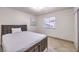 Bedroom featuring dark wood furniture, decorative painting, and a window at 3163 High View Dr, Henderson, NV 89014