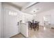 Open-concept entryway, featuring a view of the dining room with modern lighting at 3163 High View Dr, Henderson, NV 89014