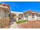 Covered front porch with seating area, gated access and desert landscaping at 3163 High View Dr, Henderson, NV 89014