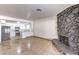 Living room view with stone fireplace and kitchen access at 3163 High View Dr, Henderson, NV 89014