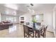 Open-concept living room featuring tile floors and modern lighting at 3163 High View Dr, Henderson, NV 89014