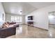 Spacious living room with large window and modern console at 3163 High View Dr, Henderson, NV 89014