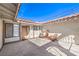 Enclosed patio space with comfortable seating, ideal for outdoor relaxation and entertainment at 3163 High View Dr, Henderson, NV 89014