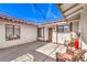 Bright enclosed patio featuring stylish furniture, ample sunlight and string lights at 3163 High View Dr, Henderson, NV 89014