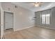 Bedroom with wood-look floors, recessed window, and door to ensuite bath at 3360 Cactus Shadow St # 102, Las Vegas, NV 89129