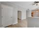 Hallway featuring natural light, neutral paint, wood-look floors and access to multiple rooms at 3360 Cactus Shadow St # 102, Las Vegas, NV 89129