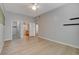 Main bedroom with wood-look floors and doors to ensuite bathroom and closet at 3360 Cactus Shadow St # 102, Las Vegas, NV 89129