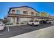 Covered parking spaces with a view of building facade, including unit numbers at 3360 Cactus Shadow St # 102, Las Vegas, NV 89129