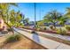 Well-kept sidewalk in a community, featuring landscaped dividers and mountain backdrop at 3360 Cactus Shadow St # 102, Las Vegas, NV 89129