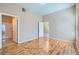 This cozy bedroom leads to a Primary bath and is finished with laminated wood flooring at 3451 Desert Cliff St # 103, Las Vegas, NV 89129