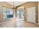 Bright dining area with tile flooring and a sliding door leading to an outdoor space at 3451 Desert Cliff St # 103, Las Vegas, NV 89129