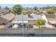 Aerial shot of the backyard with mature trees and a tall brick wall at 3730 Greenwood Dr, Las Vegas, NV 89103