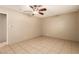 This bedroom features neutral paint, ceiling fan, and tile flooring at 3730 Greenwood Dr, Las Vegas, NV 89103