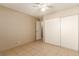 Bedroom featuring tile flooring, ceiling fan, and closet at 3730 Greenwood Dr, Las Vegas, NV 89103