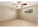 This bedroom features neutral paint, ceiling fan, and a window at 3730 Greenwood Dr, Las Vegas, NV 89103