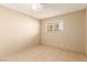 Neutral-toned bedroom with ceiling fan and tile flooring at 3730 Greenwood Dr, Las Vegas, NV 89103