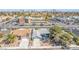 Aerial view of house with 2 car garage, mature trees and landscaping near a busy street at 3730 Greenwood Dr, Las Vegas, NV 89103