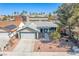 Aerial view of home with front yard, driveway, and a two-car garage at 3730 Greenwood Dr, Las Vegas, NV 89103