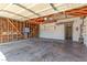 Spacious garage with exposed framing and lighting fixture at 3730 Greenwood Dr, Las Vegas, NV 89103