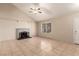 Inviting living area with vaulted ceilings, tile floors, a cozy fireplace, and plenty of natural light at 3730 Greenwood Dr, Las Vegas, NV 89103