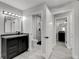 Modern bathroom features a sleek vanity, a contemporary mirror, and fixtures and bright lighting at 3998 Foxgrove Dr, Las Vegas, NV 89147