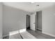 Bedroom featuring gray walls, laminate floors, a closet, and a bright window at 3998 Foxgrove Dr, Las Vegas, NV 89147