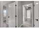 Bright hallway with hardwood floors and white trim and doors at 3998 Foxgrove Dr, Las Vegas, NV 89147