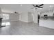 Open-concept living room showcasing hardwood floors and a seamless connection to the modern kitchen at 3998 Foxgrove Dr, Las Vegas, NV 89147