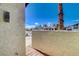 Enclosed patio with stucco walls and desert landscaping at 3998 Foxgrove Dr, Las Vegas, NV 89147