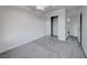 Spacious bedroom featuring neutral colored carpet, fan, and closet at 402 Bell Ave, Henderson, NV 89015