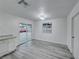 Bright dining area with modern gray flooring, sleek cabinets, and sliding glass doors for natural light at 402 Bell Ave, Henderson, NV 89015