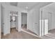 Upstairs hallway featuring hardwood floor entry and nearby bathroom at 4228 Hickman Ct, Las Vegas, NV 89129