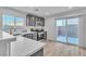 Modern kitchen with stainless steel appliances, granite countertops, and a view to the patio at 4228 Hickman Ct, Las Vegas, NV 89129