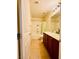 Well-lit bathroom featuring double vanity sinks and a shower-tub combination at 4562 White Cap Mill St, Las Vegas, NV 89147