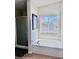 Clean bathroom showcases neutral walls, a shower, a tub, and a window for natural light at 4562 White Cap Mill St, Las Vegas, NV 89147