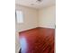 Bedroom with hardwood flooring and natural light coming from a window at 4562 White Cap Mill St, Las Vegas, NV 89147