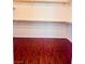 Walk-in closet with wood-look flooring and shelving for ample storage at 4562 White Cap Mill St, Las Vegas, NV 89147