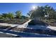 Manicured green space with walking path, attractive landscaping, and shade trees offers a serene environment at 4562 White Cap Mill St, Las Vegas, NV 89147