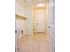 Laundry room with tile flooring and storage shelving at 4562 White Cap Mill St, Las Vegas, NV 89147