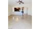 Inviting living room features tile flooring and seamlessly connects to the kitchen at 4562 White Cap Mill St, Las Vegas, NV 89147