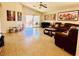 Open concept living room featuring tile floor, large sliding glass door, and recessed lighting at 4562 White Cap Mill St, Las Vegas, NV 89147