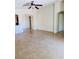 Spacious living room features tile flooring and a ceiling fan at 4562 White Cap Mill St, Las Vegas, NV 89147