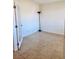 Cozy room features neutral walls, tile flooring, and a door that lets in natural light at 4562 White Cap Mill St, Las Vegas, NV 89147