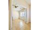Bright room features tile flooring, neutral walls, a ceiling fan, and a window at 4562 White Cap Mill St, Las Vegas, NV 89147
