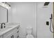 Modern bathroom with new vanity, fixtures, toilet, and shower with custom tile at 4629 Lilliput Ln, Las Vegas, NV 89102