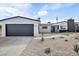 Charming single-story home featuring a freshly painted exterior, garage, and desert landscaping at 4629 Lilliput Ln, Las Vegas, NV 89102