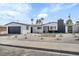 Charming single-story home featuring a freshly painted exterior, garage, and desert landscaping at 4629 Lilliput Ln, Las Vegas, NV 89102